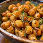 Close-up of golden roasted chickpeas with a crispy texture.