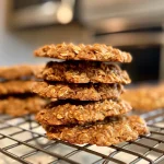 Close-up view of freshly baked Peanut Butter and Banana Oatmeal Cookies with a golden-brown color.