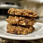 Close-up of a delicious oatmeal protein breakfast cookie with chocolate chips.
