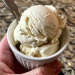 Close-up view of creamy no-churn vanilla protein ice cream in a bowl.