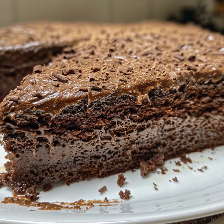 Close-up side view of a moist gluten-free chocolate cake, showcasing rich textures and layers.