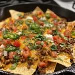 A close-up view of low carb nachos featuring crispy cheese chips.