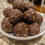 Close-up view of chocolate energy bites, showcasing a rich, textured surface.