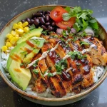['A close-up view of a BBQ chicken rice bowl, showcasing layers of rice, chicken, corn, black beans, and avocado.', 'Side view of a delicious BBQ chicken rice bowl with colorful ingredients like sweet corn, black beans, and fresh cilantro.', 'Close-up image of a BBQ chicken rice bowl, featuring juicy chicken, rice, and vibrant toppings.', 'Detailed side view of a BBQ chicken rice bowl, highlighting the glossy BBQ sauce and fresh vegetables.']