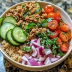 ['A vibrant Mediterranean bowl featuring ground turkey and quinoa, with colorful vegetables.', 'Close-up view of a Mediterranean salad bowl containing ground turkey, quinoa, and fresh veggies.', 'A healthy Mediterranean meal with quinoa, ground turkey, diced cucumbers, and cherry tomatoes.', 'A detailed shot of a Mediterranean bowl filled with quinoa, ground turkey, and garnished with parsley.']