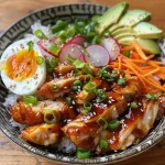 ['A close-up view of a Teriyaki Chicken Rice Bowl with garnishes.', 'Side view of a juicy Teriyaki Chicken Rice Bowl topped with sesame seeds and green onions.', 'Detailed image of a Teriyaki Chicken Rice Bowl featuring chicken, rice, and vegetables.', 'Close-up of a rice bowl filled with teriyaki chicken, rice, and colorful veggies.']