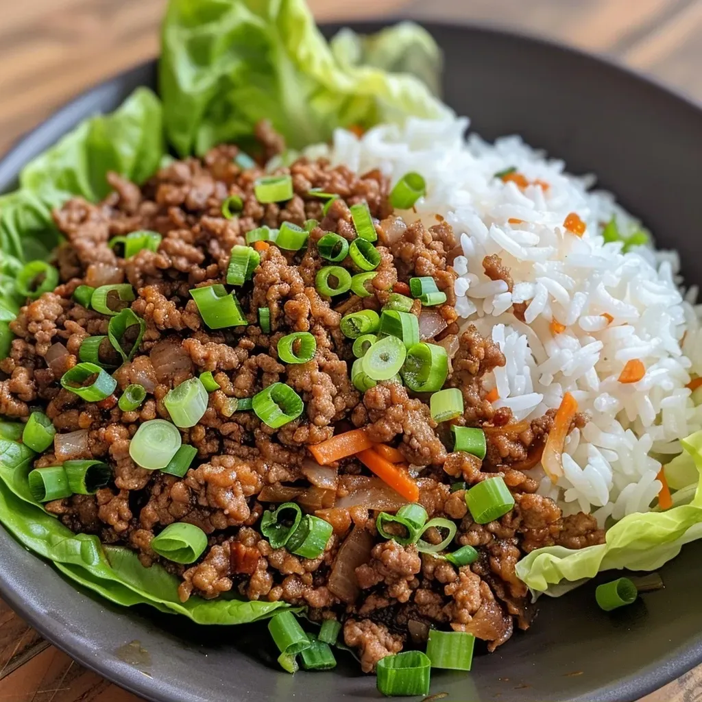 Close-up view of Teriyaki Ground Beef Lettuce Wraps on a plate, showcasing vibrant colors and textures.