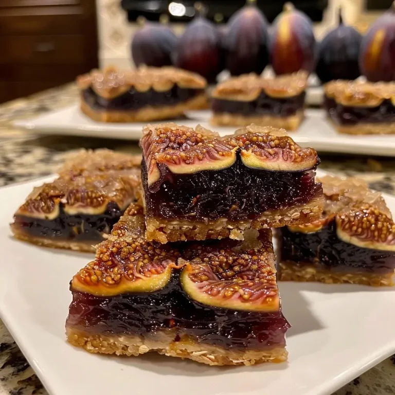 Close-up view of a slice of homemade Fig Newton bar, featuring a rich fig filling and soft crust.